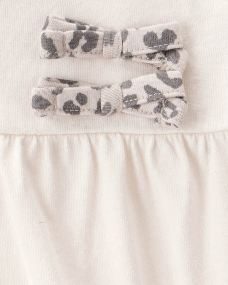 Conjunto 2 piezas con body de lazos y pantalón leopardo