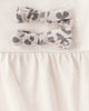 Conjunto 2 piezas con body de lazos y pantalón leopardo